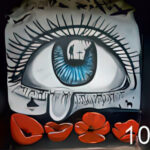 A mural in the Carr Lodge Park shelter- a blue eye crying a single tear onto four red poppies below