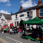 Horbury Street Fair- residents walking down a street with pop up stalls and gazebos