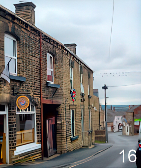 The view down Queen Street- house buildings and a pavement