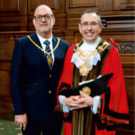 Mayor of Wakefield, Darren Byford & his Consort, Peter Davis standing together smiling for the photo