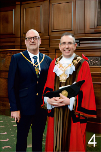 Mayor of Wakefield, Darren Byford & his Consort, Peter Davis standing together smiling for the photo